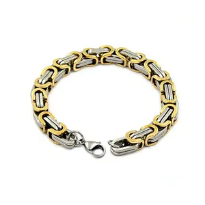 High-quality detailed view of a two-tone gold and silver stainless steel Byzantine chain bracelet