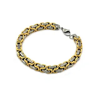 Detailed view of men's two-tone Byzantine chain bracelet in gold and stainless steel finish