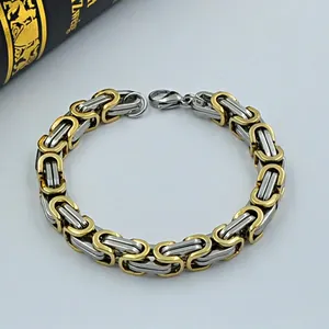 Detailed macro view of two-tone Byzantine stainless steel chain bracelet for men