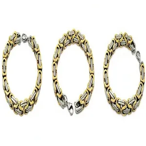 Detail view of two-tone Byzantine chain bracelets in gold and silver stainless steel