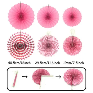 Pink paper fan flower set for wedding party decoration, various sizes and dot patterns.