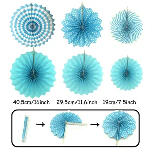Detail view of blue and white paper fan decorations with size specs and assembly guide.