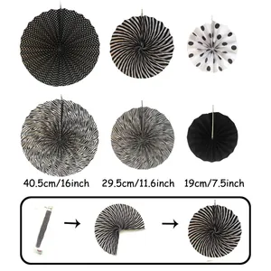 Black and white paper fan decorations set for wedding party supplies and wall decor display.