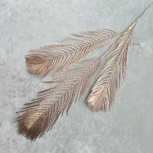 Detailed view of the golden artificial plant branch, perfect for wedding and home decor display.