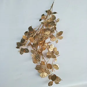 Gold artificial plant branch decorative leaf spray for wedding home floral display detail shot