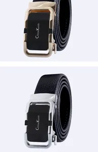 Detailed view of mens leather automatic buckle belt with metallic buckle and black strap.