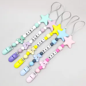 Detail view of colorful silicone baby pacifier clips with koala and star beads