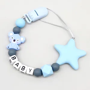 Detailed macro shot of baby silicone pacifier clip with cute koala and star beads