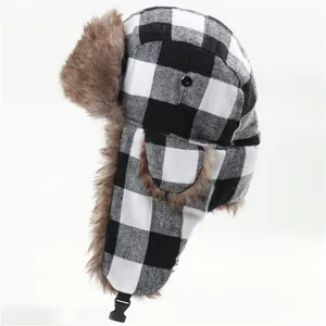 Close-up view of the classic black and white plaid winter trapper hat with soft brown faux fur.