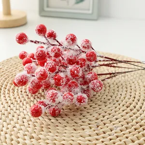 Close up of frosted red berry branches detail for Christmas DIY floral wreath decor.