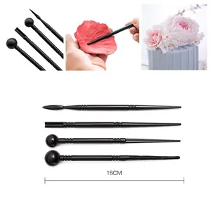 Black plastic fondant modeling tools set for cake decorating, pottery, and clay sculpture crafting.