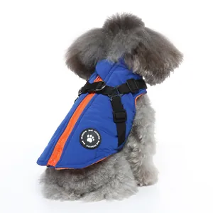 Warm blue winter dog jacket with integrated harness and bright orange zipper closure