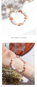 Detailed view of elegant irregular freshwater pearl bracelet with peach stones and gold clasp
