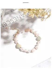 Close-up detail of irregular freshwater pearl bracelet with green aventurine and quartz