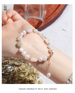 Detail shot of irregular freshwater pearl bracelet with green aventurine and pink stones