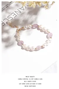Detail view of irregular freshwater pearl bracelet with purple crystal beads and gold clasp.