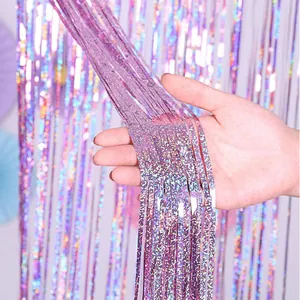 Holographic tinsel fringe curtain shimmering foil background for wedding birthday party decor.