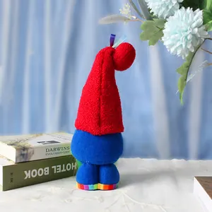 Cute rainbow gnome plush toy with long hat and blue body, perfect holiday home decor and gift.