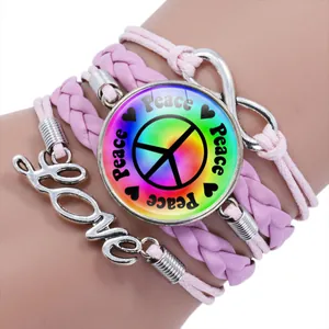 Handmade pink multi-layer braided bracelet featuring colorful peace sign and Love charm