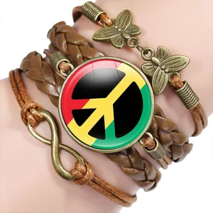 Handmade multi-layer braided leather bracelet with peace sign cabochon and butterfly charms