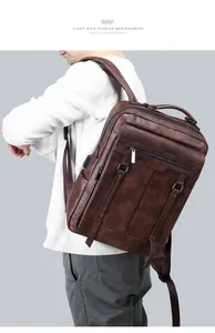 Close-up detail of stylish brown PU leather men backpack showing front zipper and straps.