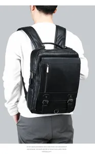 Detail view of the black PU leather casual business backpack worn by model, showing straps.