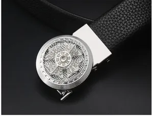 Close-up view of the luxury men belt buckle, featuring metallic rhinestone cross design.