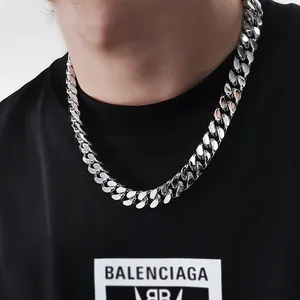 Chunky silver titanium steel Cuban link necklace for men shown on black t-shirt