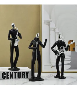 Vista macro de figuras de músicos negros minimalistas con detalles cromados decoración