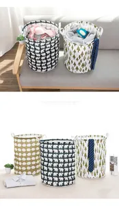Detailed view of foldable cloth laundry baskets with various animal and tree patterns