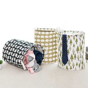 Set of three foldable fabric laundry baskets with animal and tree patterns for home storage