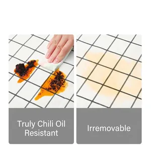 Waterproof and oil-proof PVC grid tablecloth showing easy cleaning of stubborn oil stains