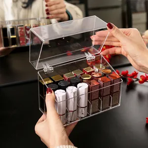 Transparent acrylic dustproof lipstick organizer with eighteen slots and flip-top lid.