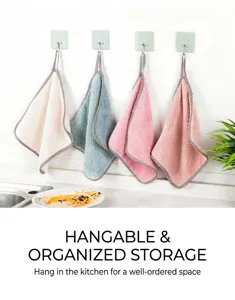 Four-color soft coral fleece hand towels hanging in a kitchen setting for easy storage