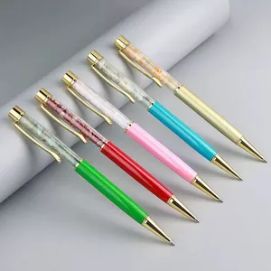 Crystal stone ballpoint pens with colorful metal barrels and gemstone filling for office use.