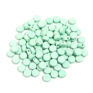 Mint green acrylic flat round loose beads with small holes for DIY bracelet craft jewelry making.