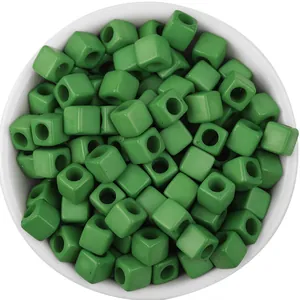 Green acrylic square cube beads with large holes for DIY handmade jewelry crafting projects.
