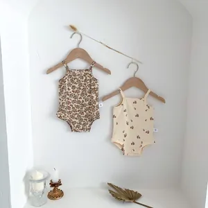 Baby floral strap romper detail view, summer sleeveless bodysuit with cute floral prints.