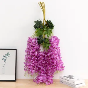 Artificial wisteria hanging flower vine for wedding background, ceiling decor detail view.