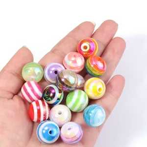 Close-up detail shot of colorful striped rainbow beads, perfect for DIY jewelry and crafts.