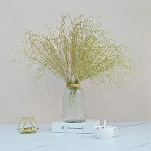 Detailed view of 53cm golden and silver artificial dragon's beard branches in a vase