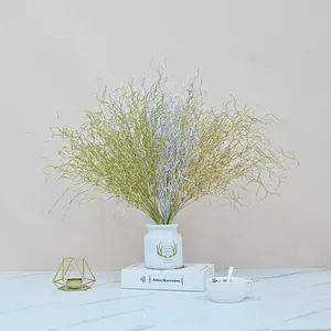Detailed view of 53cm gold and silver dragon beard grass in a white vase for home decor