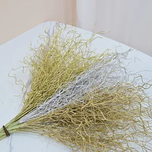 Close-up detail of 53cm metallic gold and silver curly grass for festive holiday decor