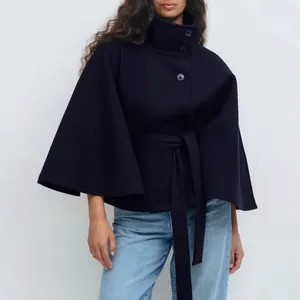 Elegant navy blue belted cape coat featuring a high collar and buttons for autumn