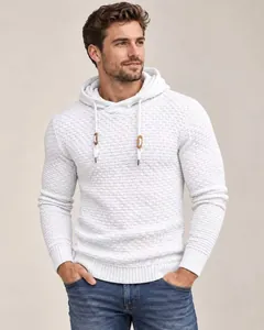 Detailed view of white textured knit hoodie with drawstring and wood toggles.