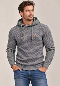 Close-up detail of a premium grey men's knitted hoodie featuring unique 3D bubble texture