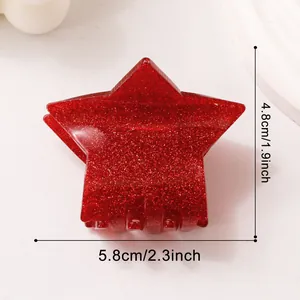 Vista dettagliata della molletta a stella con glitter rossi, dimensioni 5,8x4,8 cm