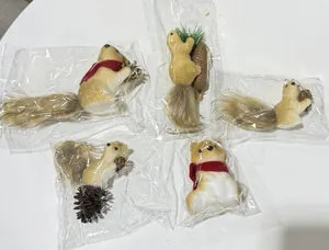 Five foam squirrel ornaments in individual plastic packaging for Christmas decor