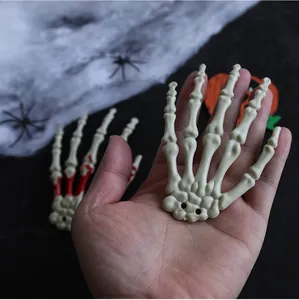 Close-up of a realistic plastic skeleton hand for Halloween decoration and horror props
