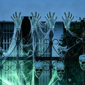 Realistic Halloween skeleton hands and skull decorations with cobwebs for fence display